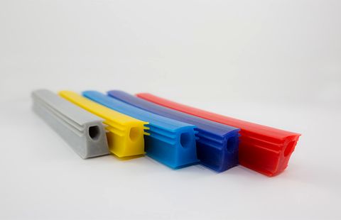 Five lengths of the same Dry Seals profile, in grey, yellow, light blue, dark blue and red.